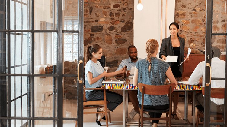 employee discussing about business in meeting room