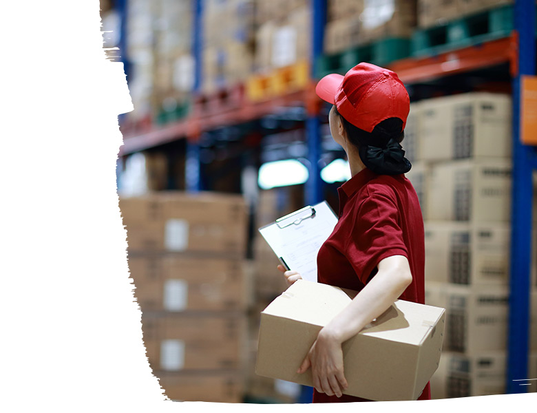 A warehouse worker surveying the warehouse floor