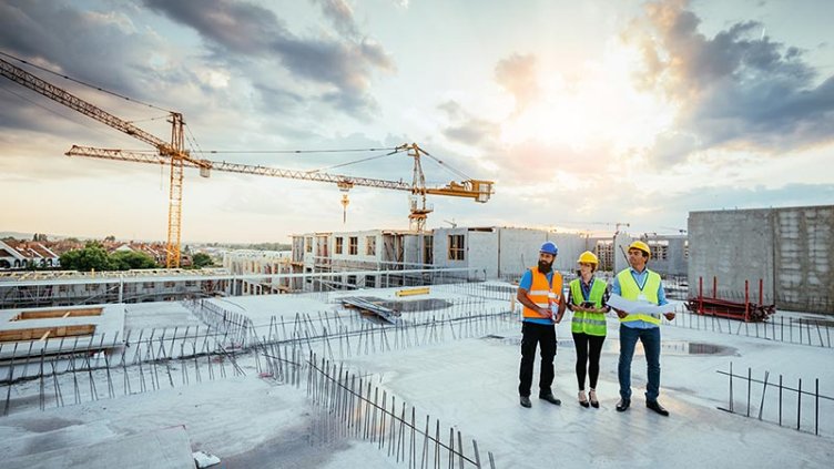 Construction engineers working on site