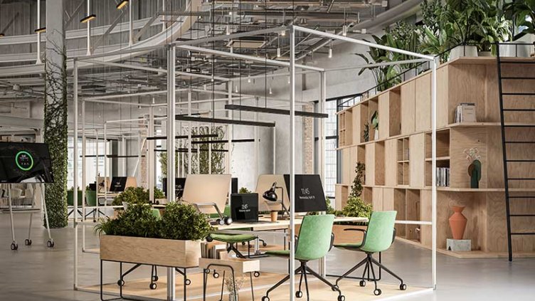 An office space featuring green plants and comfortable chairs arranged for a welcoming atmosphere.