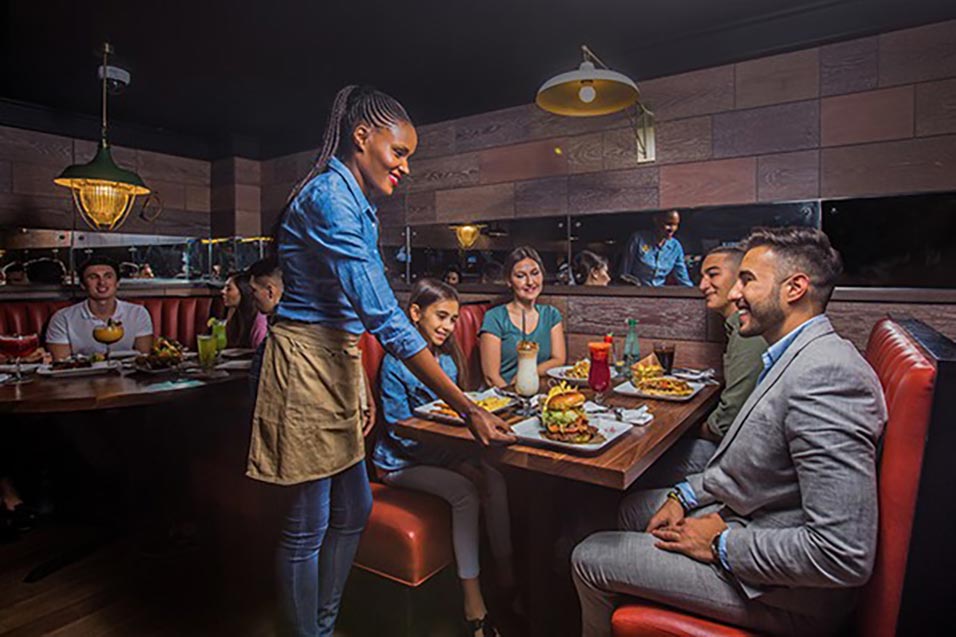 A girl is serving the food