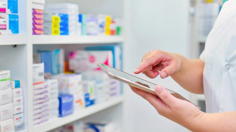 Women taking pharmacy stock