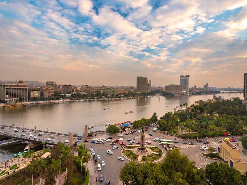 View of Tahrir Square and the surrounding buildings in Garden City at dusk