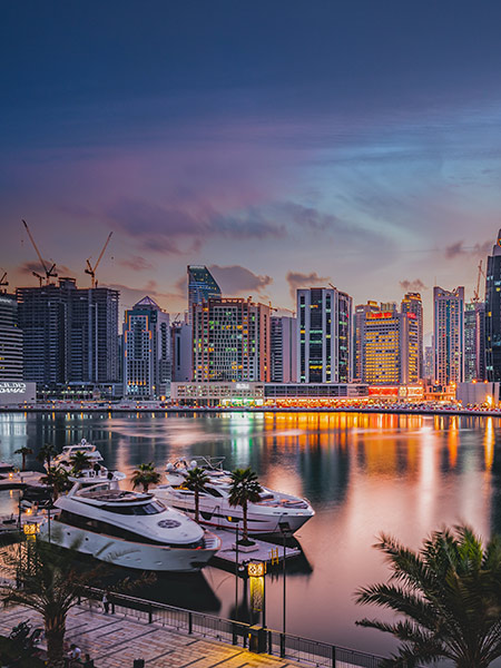 View of Multiple buildings and Boat in Sea