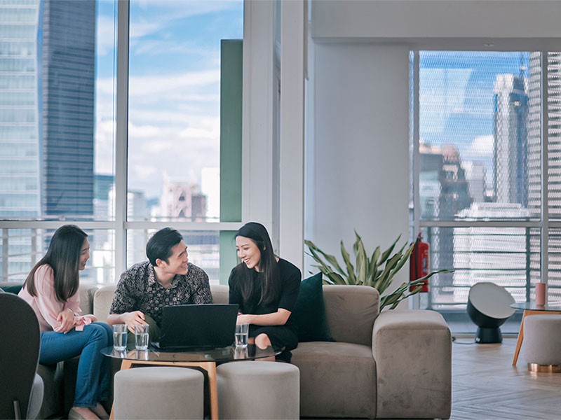 Employees working and smiling