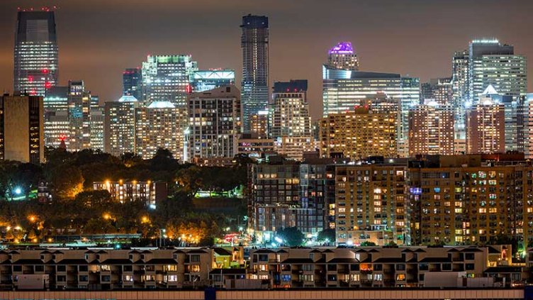 Jersey City skyline rises behind Hoboken and Weehawken cities