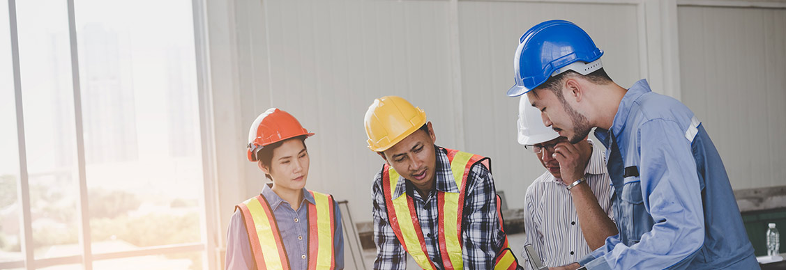 Engineers are meeting and pointing to new construction sites, Engineering tools and construction concept.