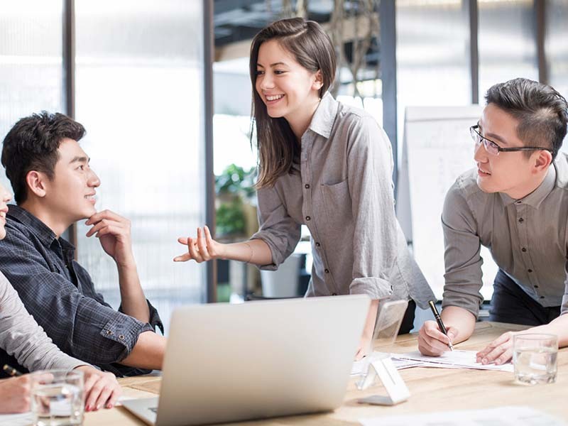 Employees discussing at meeting room